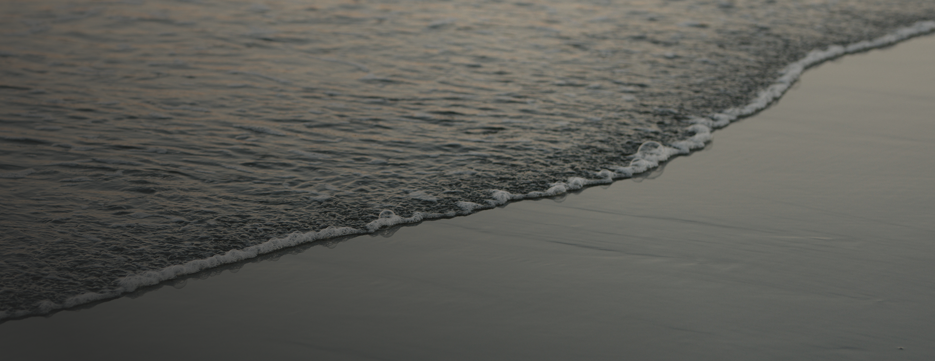 Ocean swell reaching the shoreline
