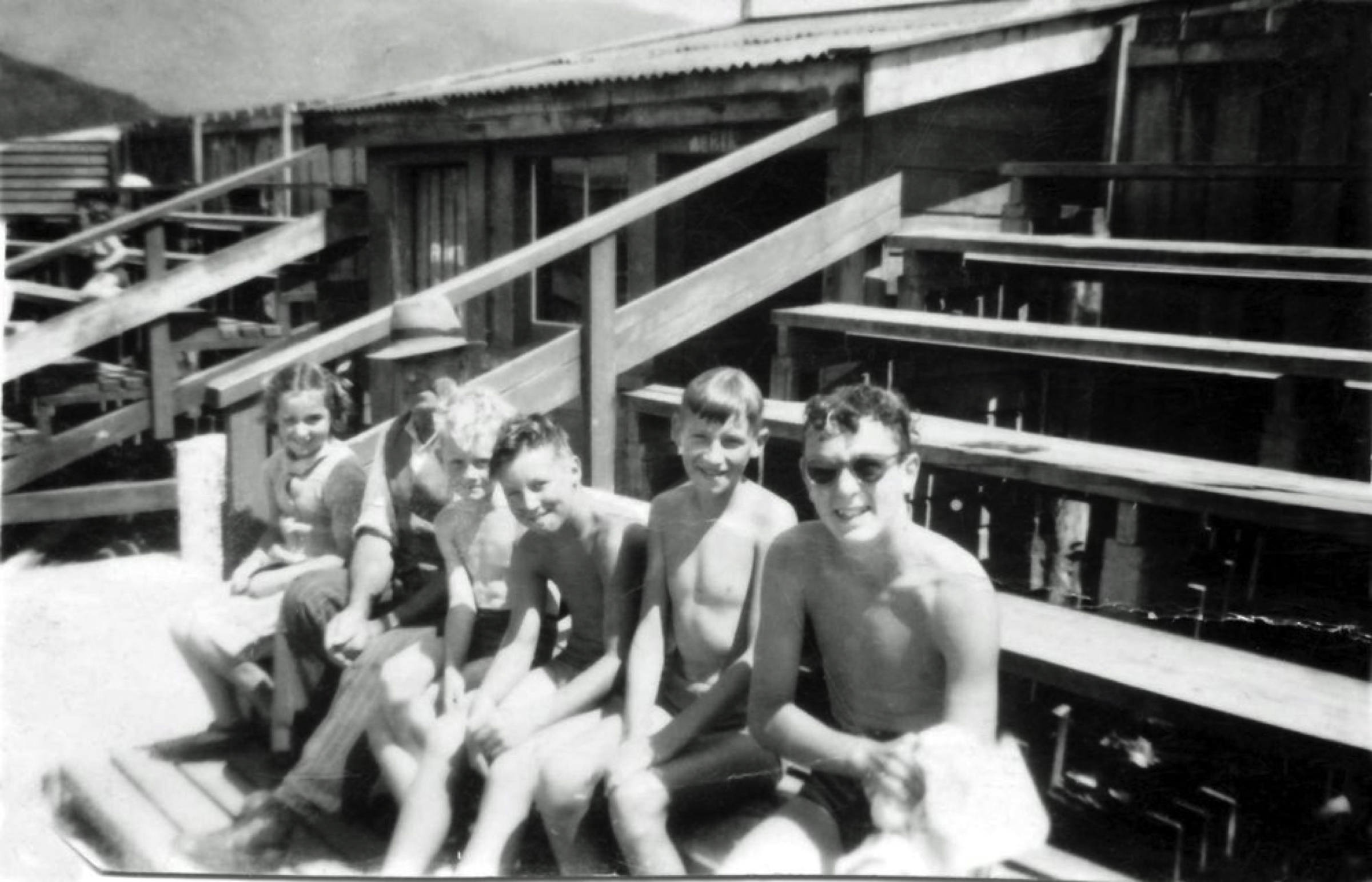 Historic black-and-white photograph of children seated in grandstand seating